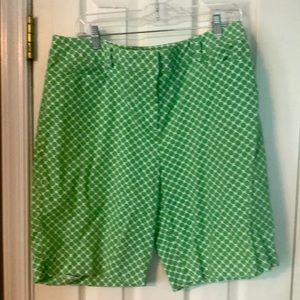Woman’s green and white Bermuda shorts